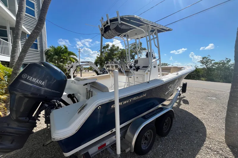 Slide: The Image of 2014 Sportsman Heritage 211 Center Console boat with Yamaha engine on trailer. - 7