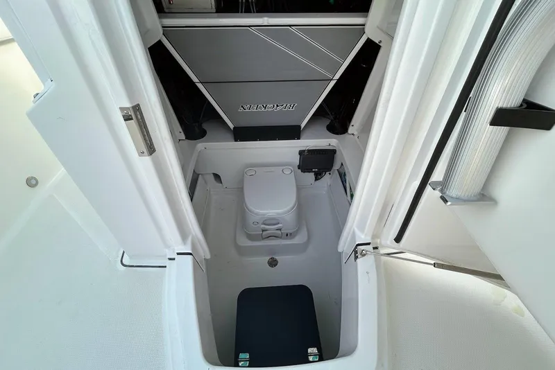 Slide: The Image of 2019 Blackfin 242 CC boat interior with compact marine toilet. - 14