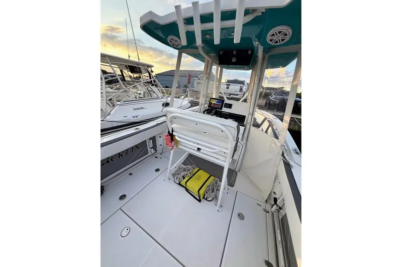 Slide: The Image of 2019 Blackfin 242 CC boat with dual engines and foldable seating. - 7