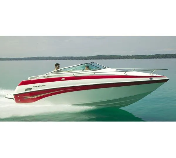The Image of 2004 Crownline 235 CCR boat on trailer, parked in marina, side view. - 0