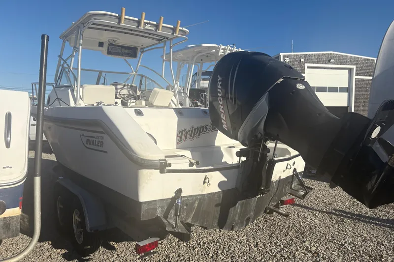 Slide: The Image of 2000 Boston Whaler 23 Conquest boat with Mercury outboard motor on trailer. - 6