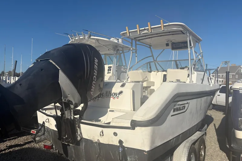 Slide: The Image of 2000 Boston Whaler 23 Conquest boat with Mercury outboard engine on trailer. - 7