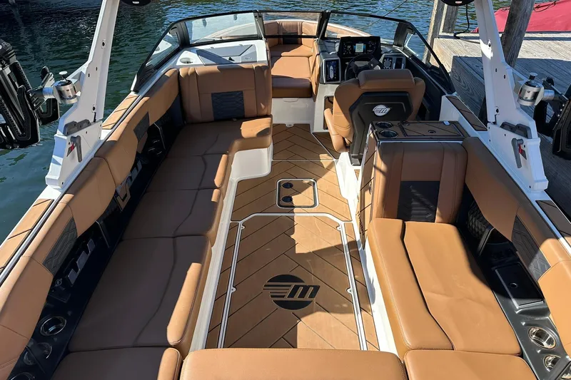 Slide: The Image of 2024 Malibu Wakesetter 25 LSV interior with tan seating and sleek design. - 10
