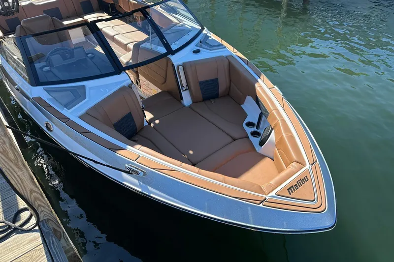 Slide: The Image of 2024 Malibu Wakesetter 25 LSV boat with luxurious seating and sleek design. - 5