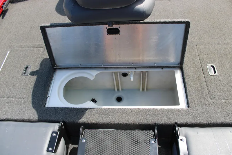 Slide: The Image of Open storage compartment on 2018 Lowe Stinger 175C boat deck. - 10