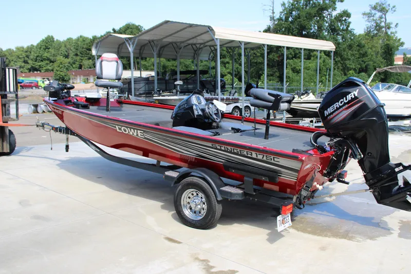 Slide: The Image of 2018 Lowe Stinger 175C boat with Mercury outboard motor on a trailer. - 3