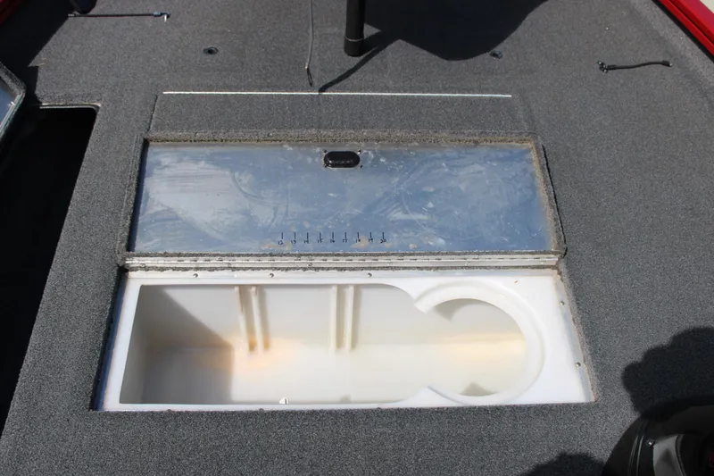 Slide: The Image of 2018 Lowe Stinger 175C boat livewell with open lid, showing interior compartment. - 5