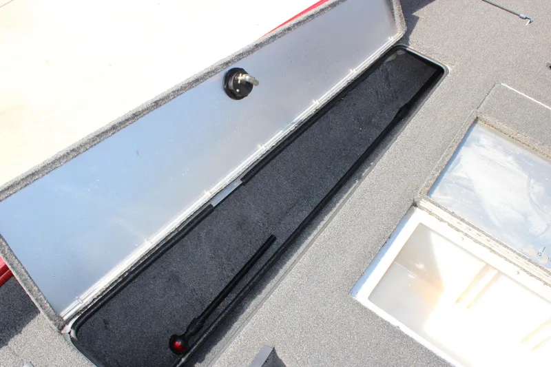 Slide: The Image of Open storage compartment in 2018 Lowe Stinger 175C boat, showcasing interior space. - 6