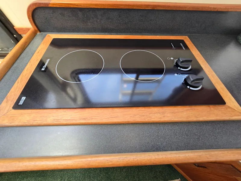 Slide: The Image of Interior of a 2001 Nordic Tug 32 with cozy seating and kitchen area. - 17