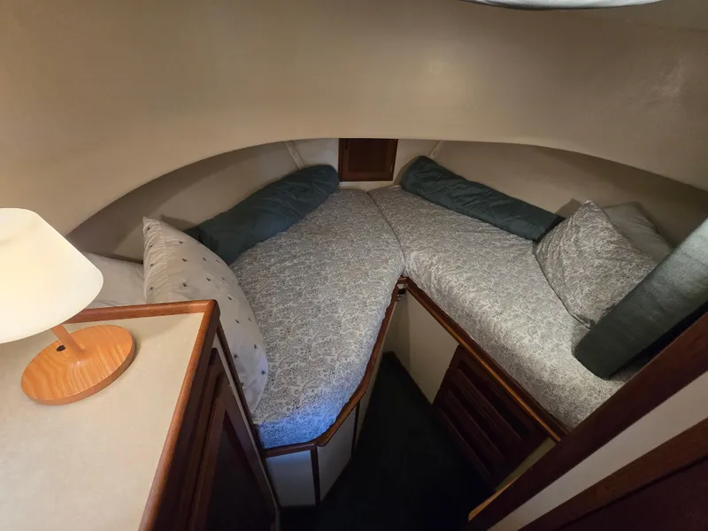 Slide: The Image of Cozy cabin interior of 2001 Nordic Tug 32 with twin beds and soft lighting. - 22