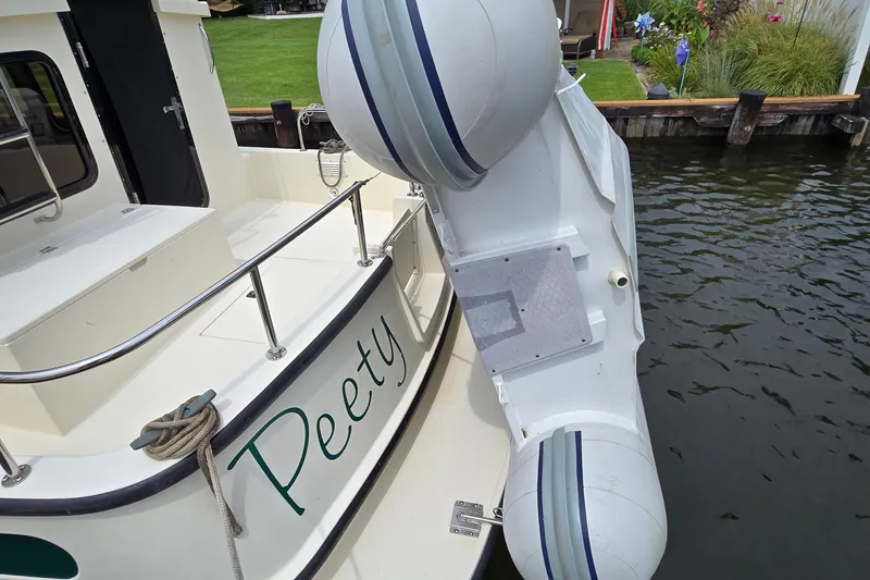 Slide: The Image of 2001 Nordic Tug 32 docked near waterfront home, available for viewing by appointment. - 42