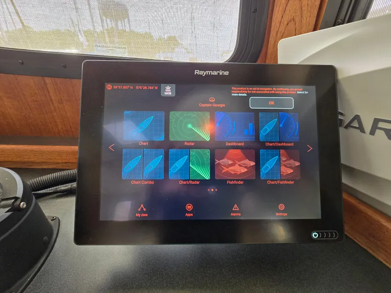 Slide: The Image of Navigation instruments on a 2001 Nordic Tug 32 boat dashboard. - 9
