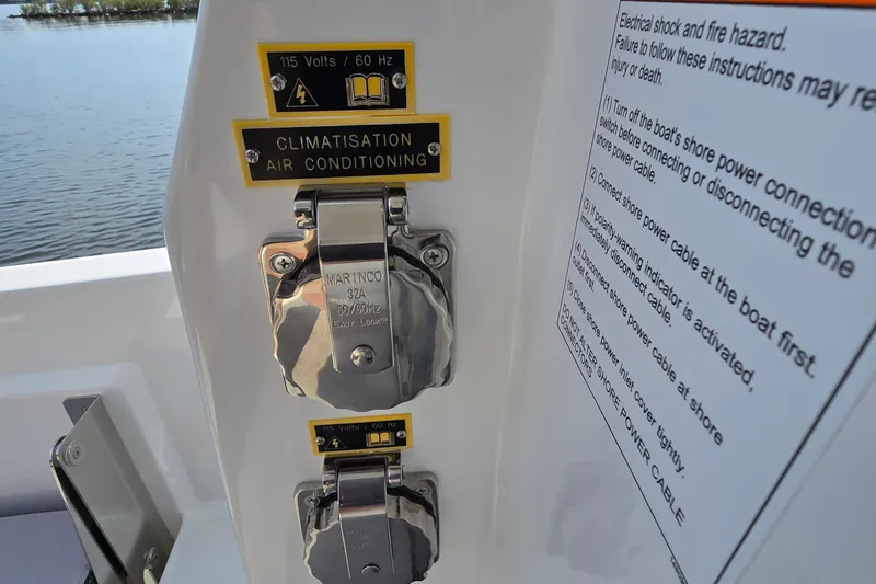 Slide: The Image of Power connections on a 2023 Jeanneau NC Sport 795 Series 2 boat, featuring air conditioning. - 22