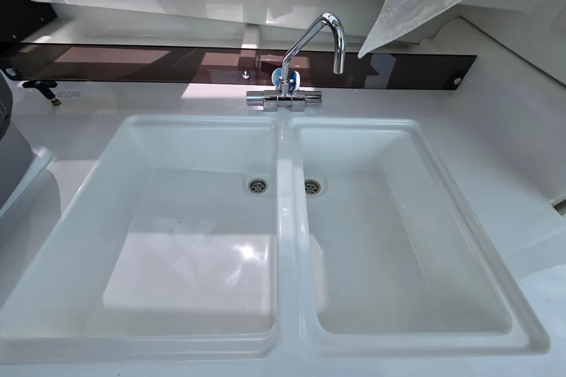 Slide: The Image of 2023 Jeanneau NC Sport 795 Series 2 kitchen sink with dual basins and modern faucet. - 27