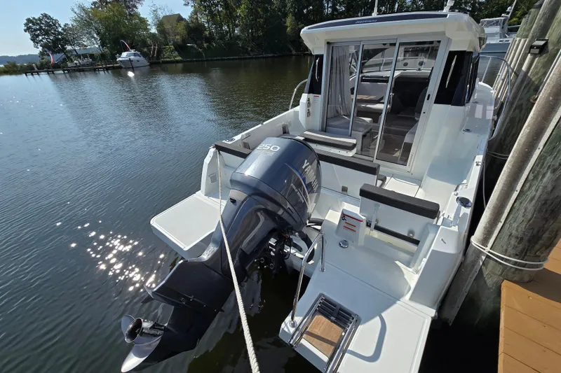 Slide: The Image of 2023 Jeanneau NC Sport 795 Series 2 boat docked with Yamaha outboard motor. - 3