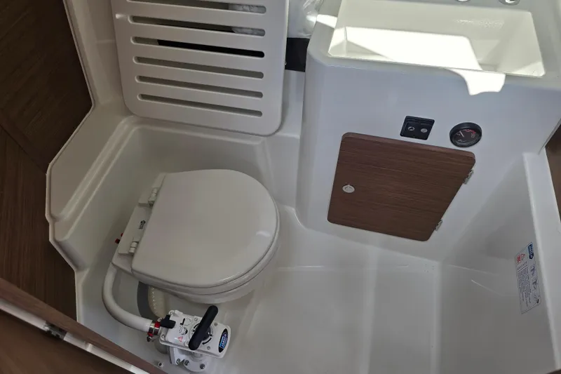 Slide: The Image of 2023 Jeanneau NC Sport 795 Series 2 boat bathroom with toilet and sink. - 34