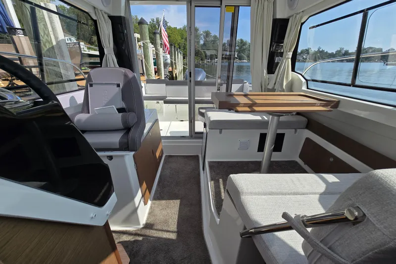 Slide: The Image of Interior of 2023 Jeanneau NC Sport 795 Series 2 boat, featuring seating and table. - 37