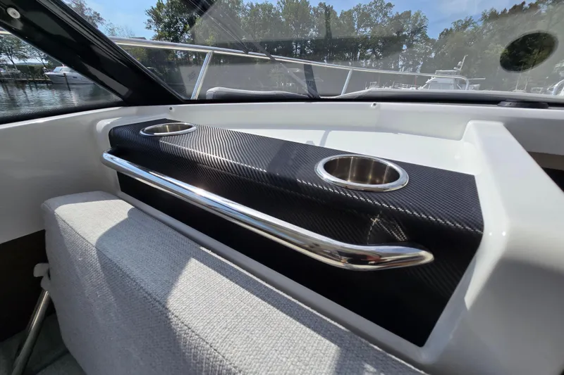 Slide: The Image of 2023 Jeanneau NC Sport 795 Series 2 interior with cup holders and sleek design. - 39