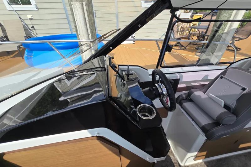 Slide: The Image of 2023 Jeanneau NC Sport 795 Series 2 cockpit with steering wheel and seating. - 41