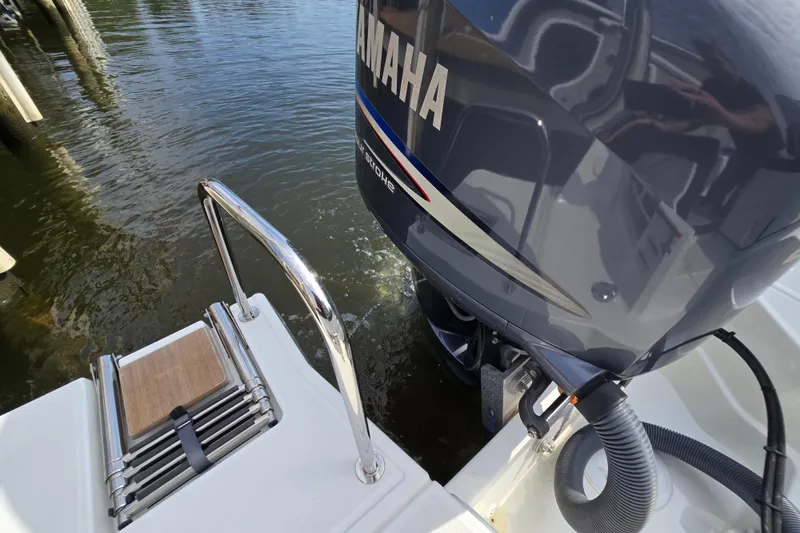 Slide: The Image of 2023 Jeanneau NC Sport 795 Series 2 with Yamaha outboard motor, docked by water. - 46