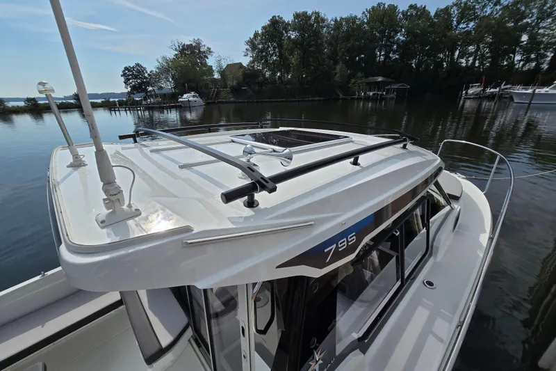 Slide: The Image of 2023 Jeanneau NC Sport 795 Series 2 boat docked on a serene lake. - 54