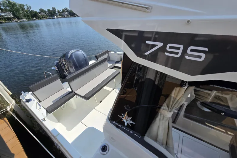 Slide: The Image of 2023 Jeanneau NC Sport 795 Series 2 boat docked by the water. - 9