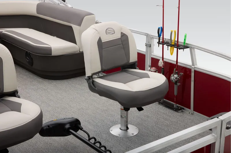 Slide: The Image of 2026 Sun Tracker Bass Buggy 16 XL Select pontoon boat on trailer, parked outside dealership. - 25