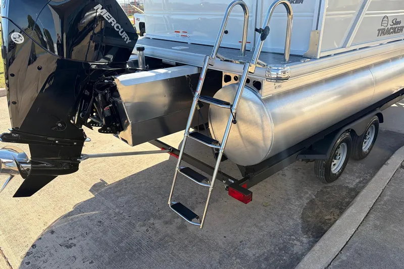 Slide: The Image of 2026 Sun Tracker Party Barge 22 RF XP3 with Mercury engine and ladder on trailer. - 11