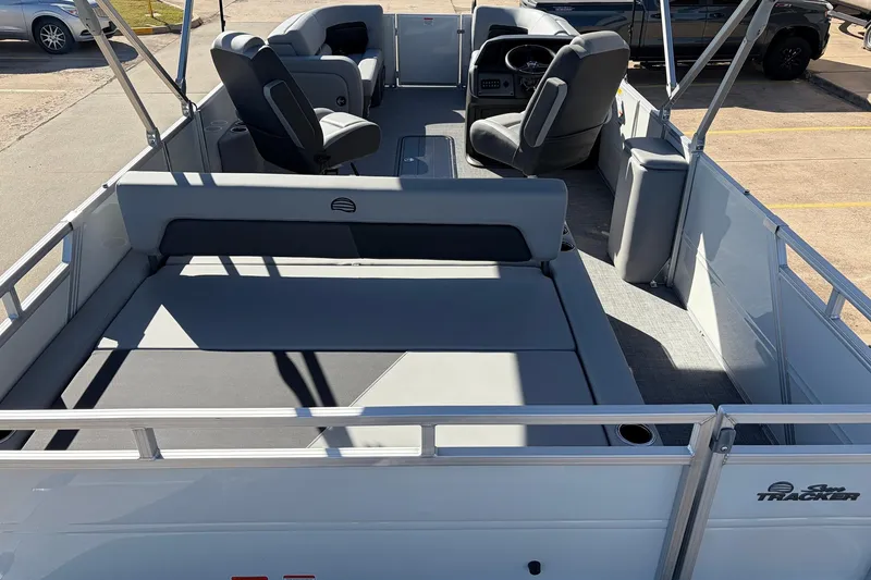 Slide: The Image of 2026 Sun Tracker Party Barge 22 RF XP3 interior with seating and steering console. - 13