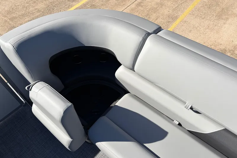 Slide: The Image of 2026 Sun Tracker Party Barge 22 RF XP3, gray seating area with cup holders. - 24
