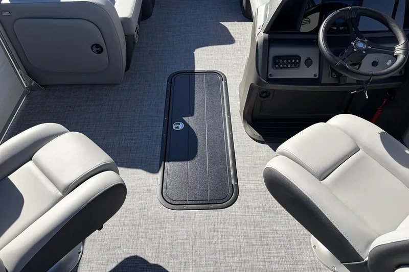 Slide: The Image of Interior of 2026 Sun Tracker Party Barge 22 RF XP3 with seating and steering console. - 28