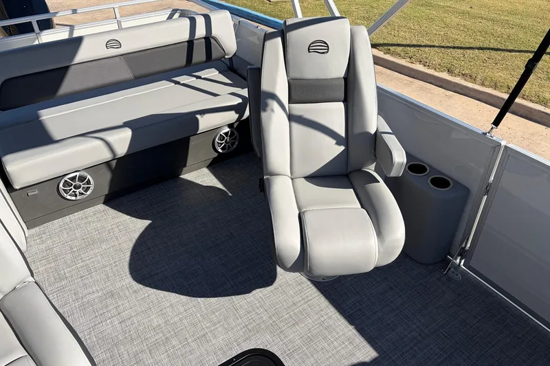 Slide: The Image of 2026 Sun Tracker Party Barge 22 RF XP3 interior with gray seating and cup holders. - 31
