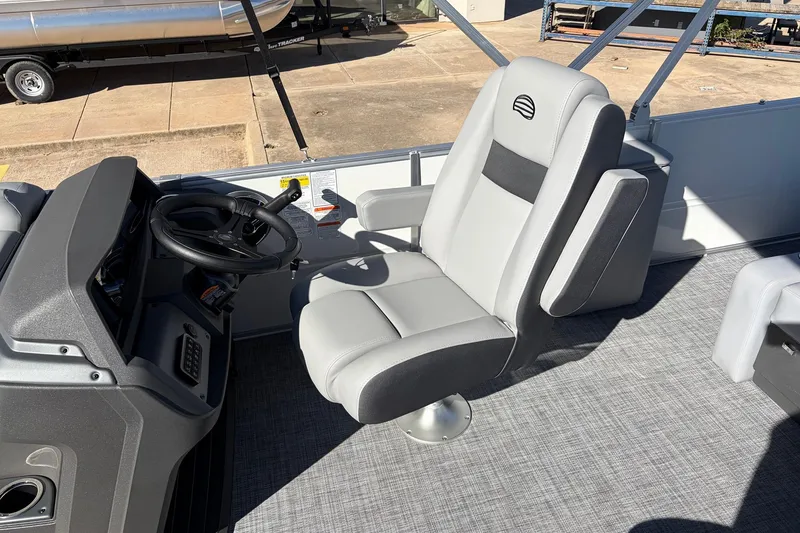 Slide: The Image of Captain's chair and helm of 2026 Sun Tracker Party Barge 22 RF XP3 pontoon boat. - 32