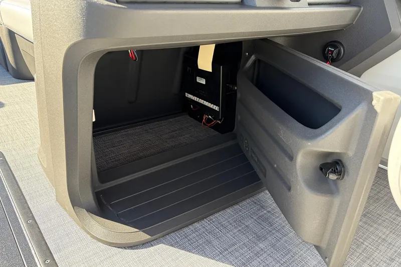 Slide: The Image of Open storage compartment on 2026 Sun Tracker Party Barge 22 RF XP3 boat. - 35