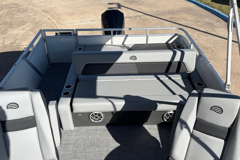 Slide: The Image of 2026 Sun Tracker Party Barge 22 RF XP3 interior with gray seating and cup holders. - 36