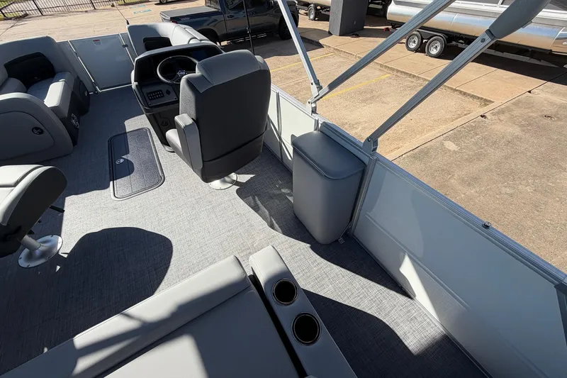 Slide: The Image of 2026 Sun Tracker Party Barge 22 RF XP3 interior with seating and steering console. - 37