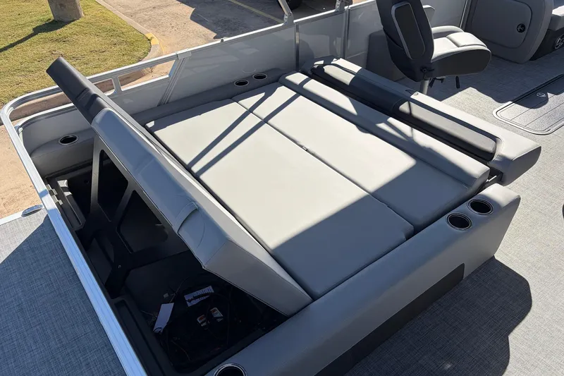 Slide: The Image of 2026 Sun Tracker Party Barge 22 RF XP3 interior with gray seating and cup holders. - 47