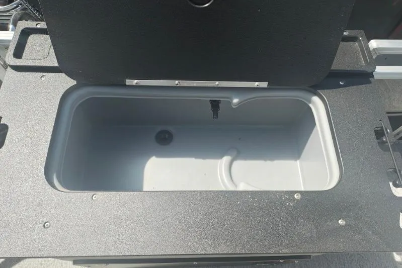 Slide: The Image of Open storage compartment on 2026 Sun Tracker Fishin' Barge 20 DLX boat. - 10