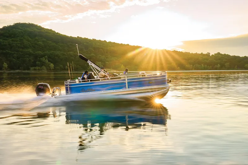 Slide: The Image of 2026 Sun Tracker Fishin' Barge 20 DLX pontoon boat with spacious seating and open deck. - 2