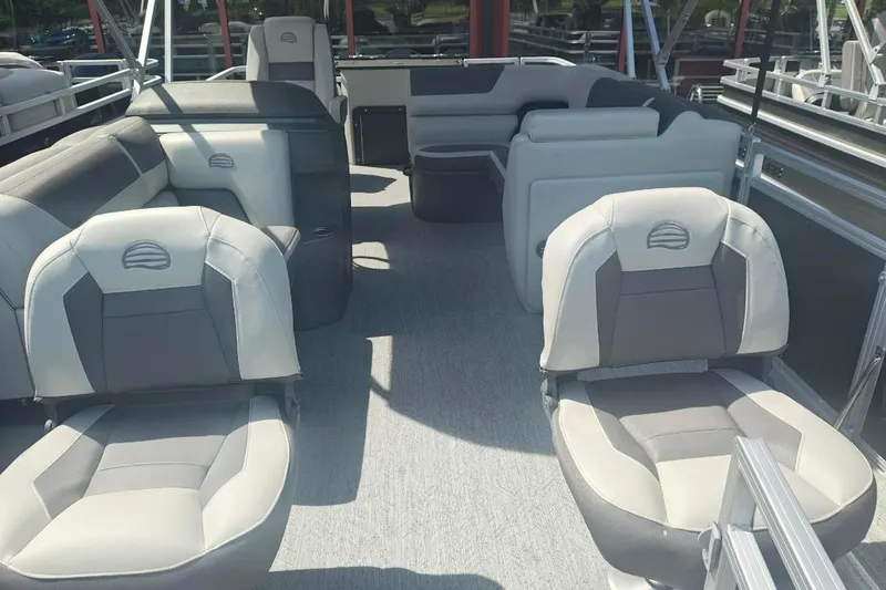 Slide: The Image of 2026 Sun Tracker Fishin' Barge 20 DLX interior with comfortable seating and spacious layout. - 21
