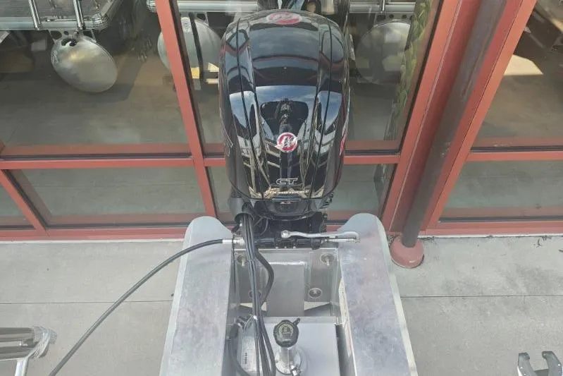 Slide: The Image of 2026 Sun Tracker Fishin' Barge 20 DLX outboard motor, black, viewed from above. - 8