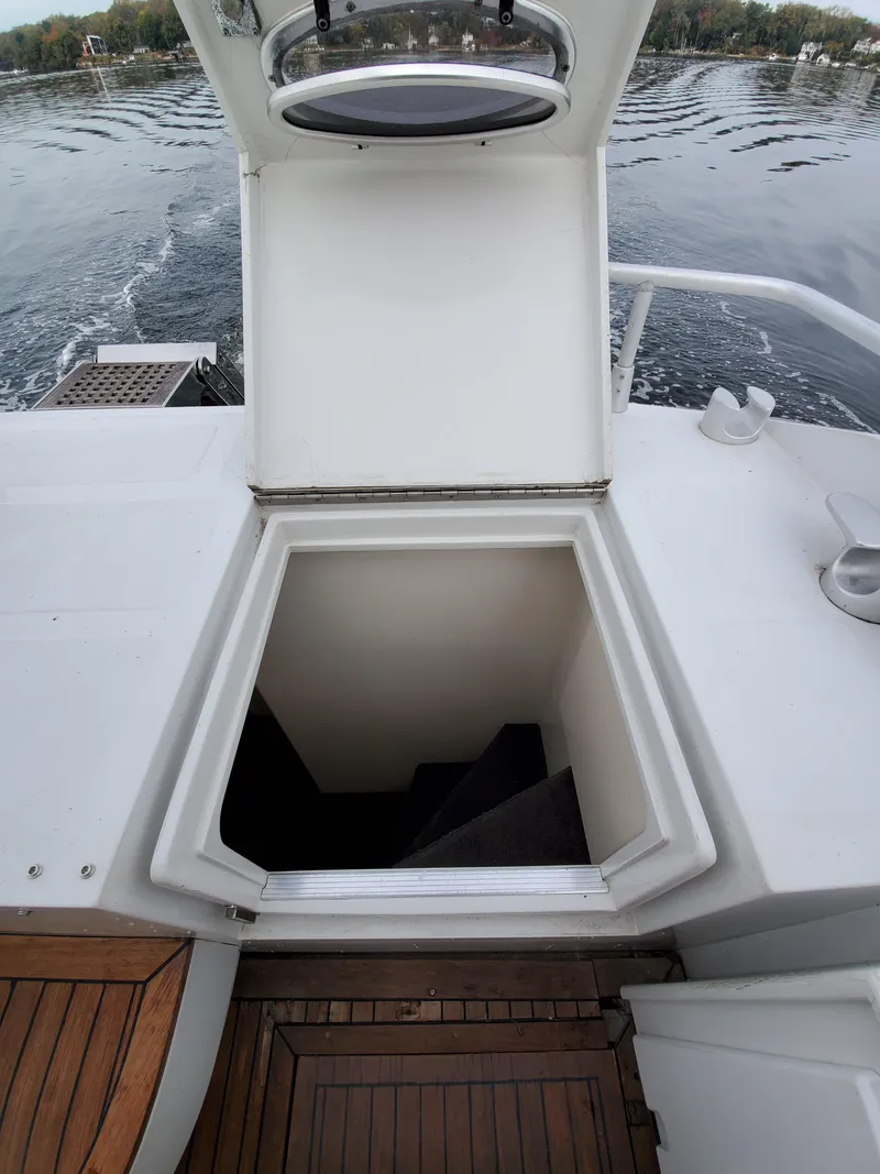 Slide: The Image of Open hatch on Giorgi 46 yacht, 1993 model, revealing stairs to lower deck. - 28