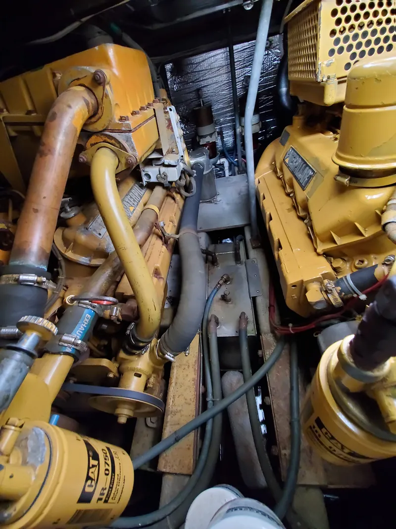 Slide: The Image of Engine room of a 1993 Giorgi 46 boat, featuring complex machinery and piping. - 34