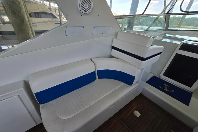 Slide: The Image of Interior of a 1993 Giorgi 46 yacht with white and blue seating. - 88