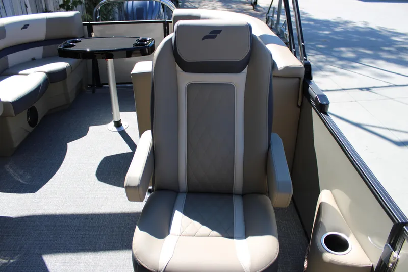 Slide: The Image of Luxurious seating on 2026 Starcraft EXS 1 boat with cup holder and table. - 15