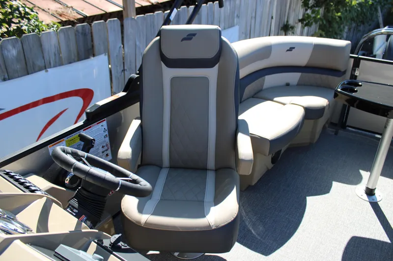 Slide: The Image of Luxurious interior of 2026 Starcraft EXS 1 boat with plush seating and modern steering. - 16