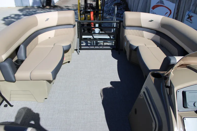 Slide: The Image of 2026 Starcraft EXS 1 boat interior with beige seating and modern design. - 17