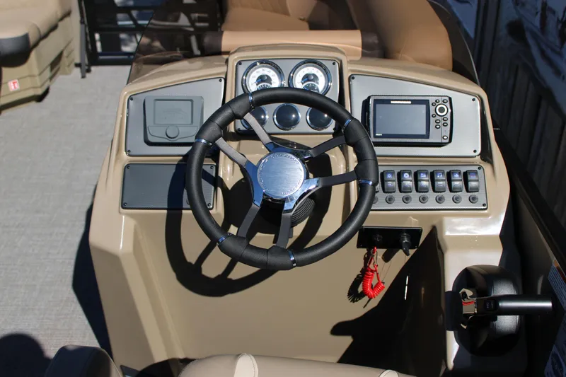 Slide: The Image of 2026 Starcraft EXS 1 boat dashboard with steering wheel and control panel. - 8