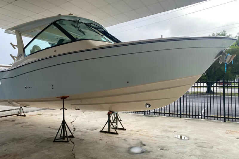 The Image of 2025 Grady-White Freedom 345 boat on stands, under a covered area. - 0