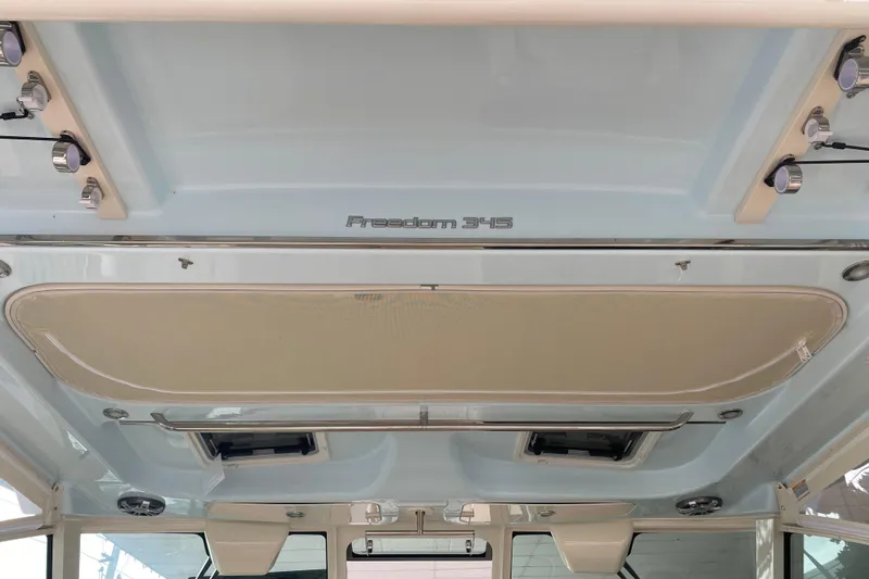 Slide: The Image of 2025 Grady-White Freedom 345 boat interior ceiling with lighting fixtures. - 13